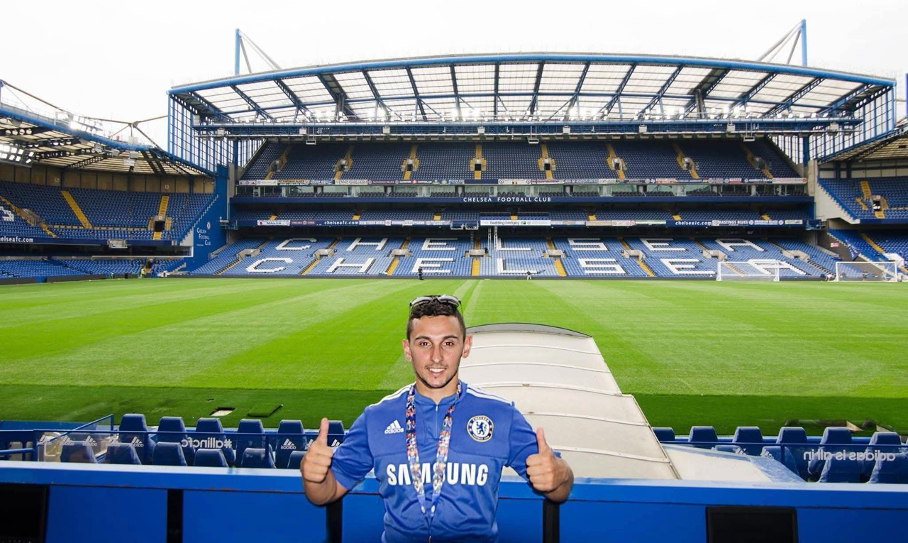 Nik inside Chelsea Football Club stadium during a 2014 Europe trip before Royale Photography began.