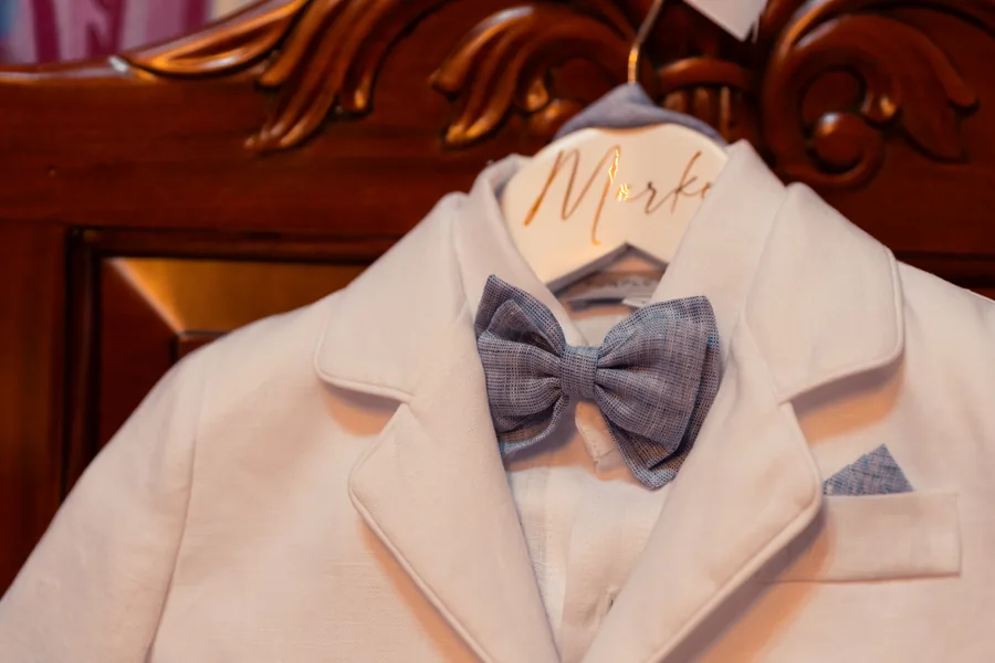 Christening outfit detail photographed before an Orthodox baptism in Melbourne