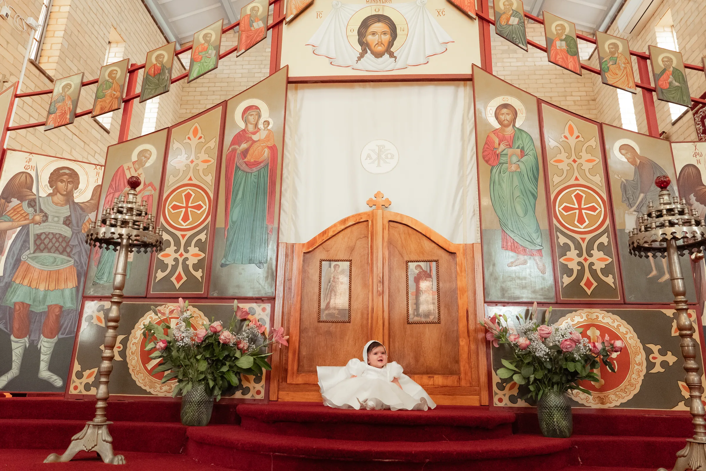 Wide church scene during a Melbourne Orthodox or Catholic baptism ceremony
