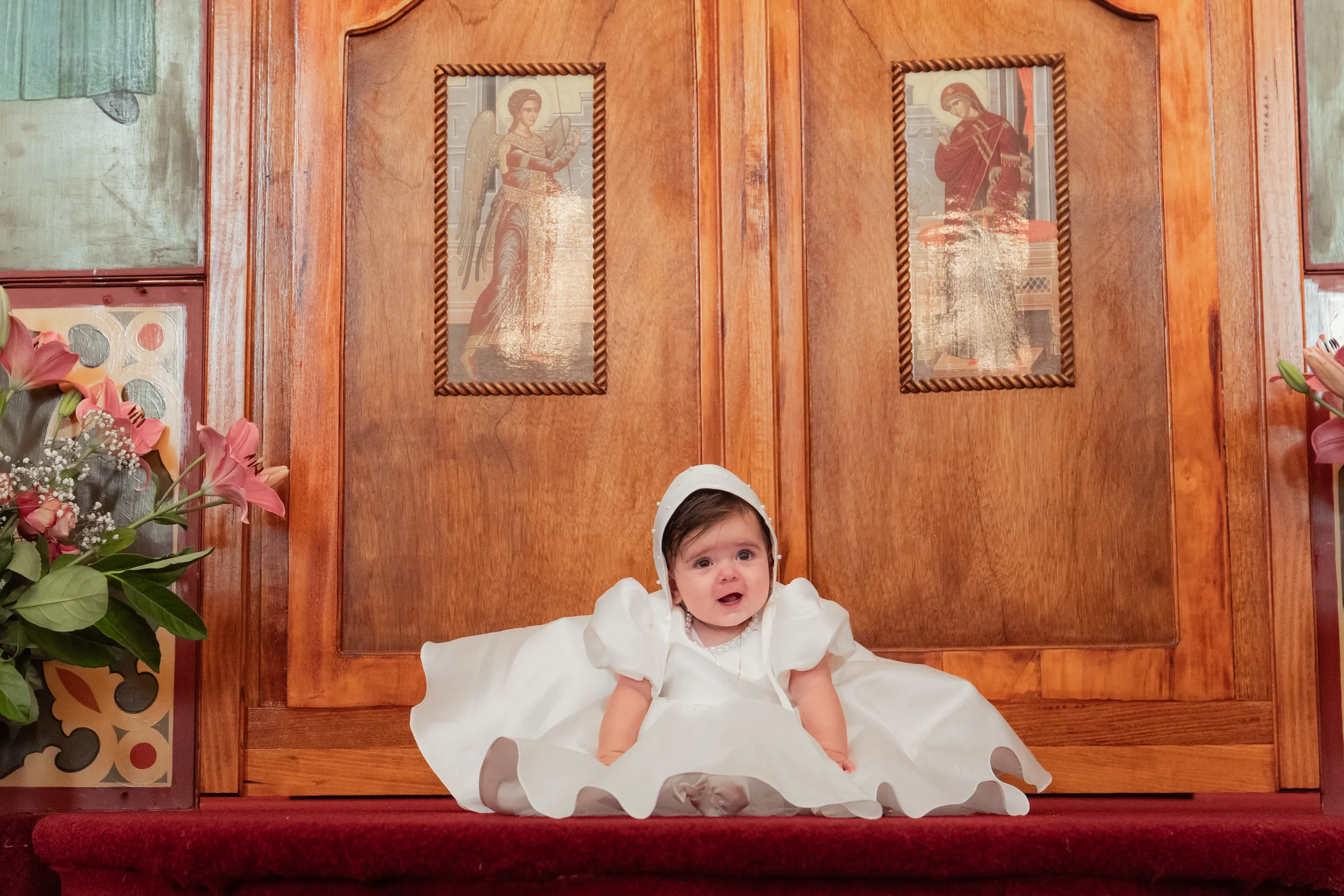 Baby at the altar during a Melbourne christening photographed respectfully in church light