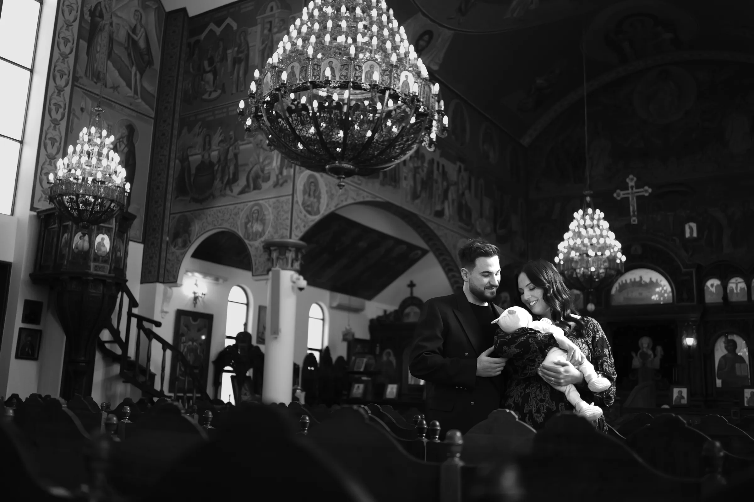 Black and white documentary christening photograph inside a Melbourne church
