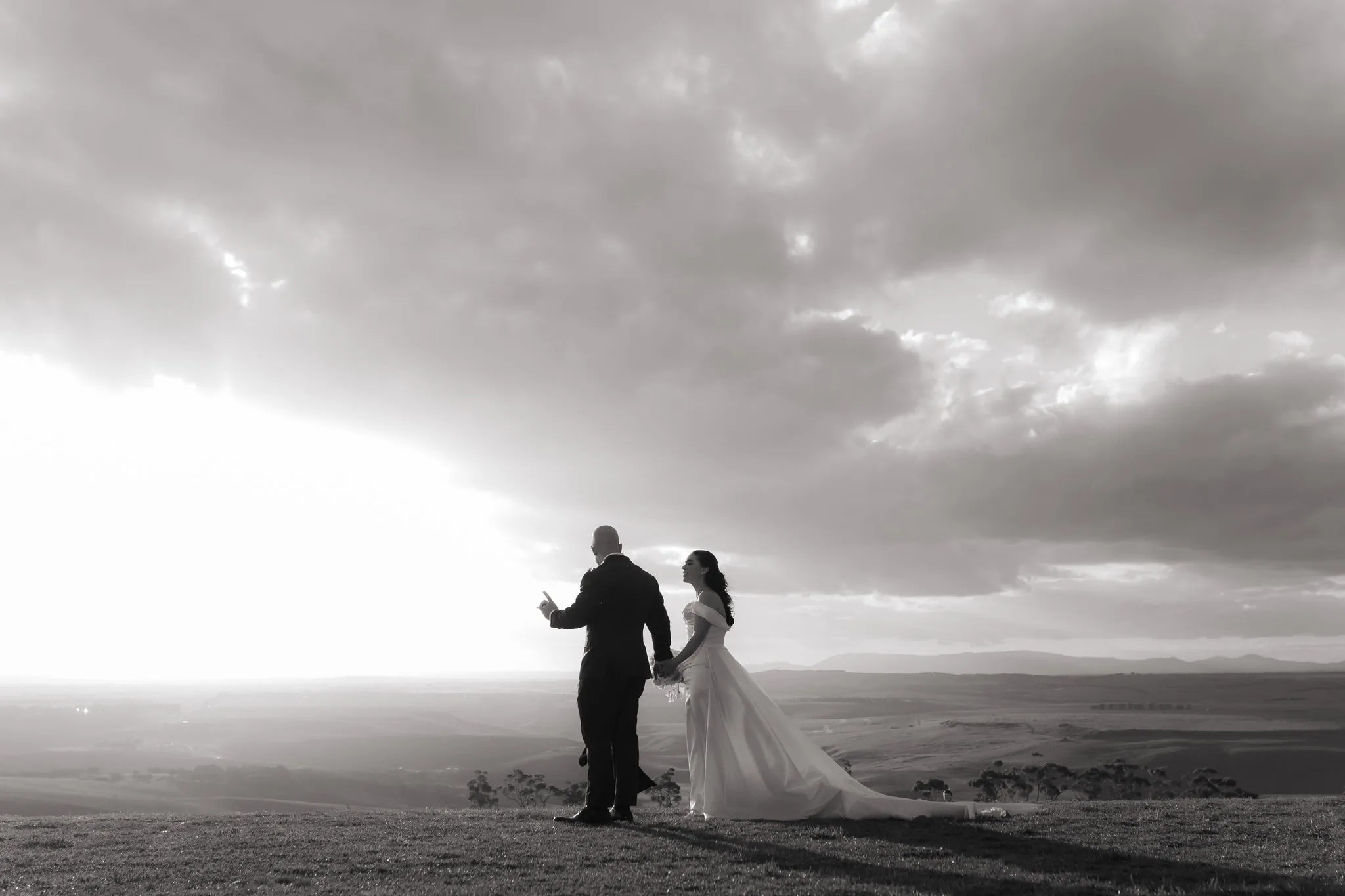 Dramatic hilltop wedding silhouette photographed by Royale Photography