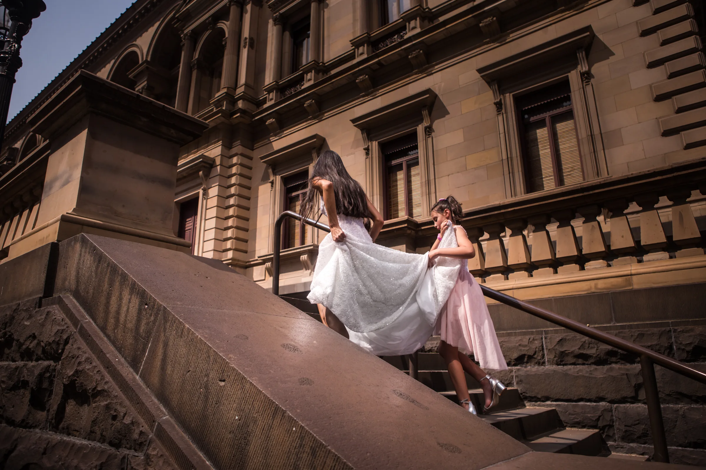 Wedding couple on architectural stairs photographed by Royale Photography