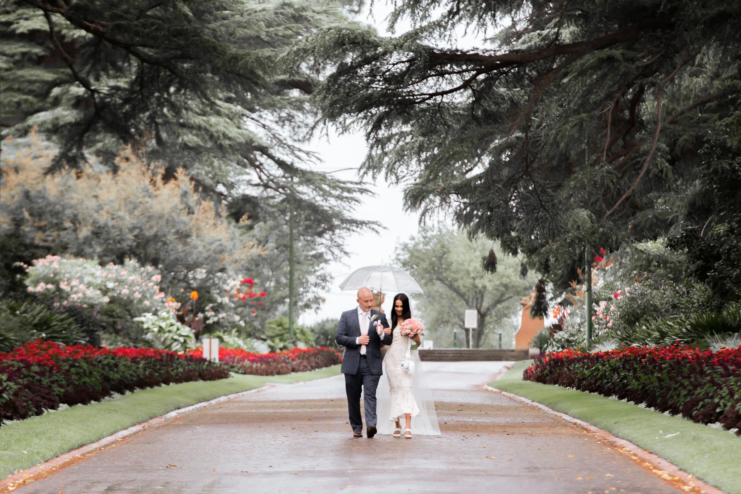 Melbourne wedding couple walking through a garden photographed by Royale Photography